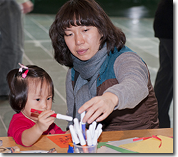 Making a holiday greeting for a veteran, Remembrance Day 2011.
© Canadian War Museum, photo Alex Lukey, CWM2011-0092-0038-Dm
