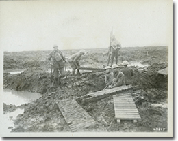 Canadian Pioneers laying duckboards over mud during the Battle of Passchendaele, November 1917.
George Metcalf Archival Collection
CWM 19930013-480
O.2217
© Canadian War Museum
