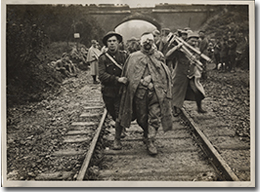 A Canadian soldier helping a wounded German soldier, no date.
George Metcalf Archival Collection
CWM 19910162-009
© Canadian War Museum
