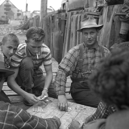 Fishermen playing poker for money on the dock, Paspbiac, Gaspsie, Qubec, 1958., © CMC/MCC, Carmen Roy, J-15483