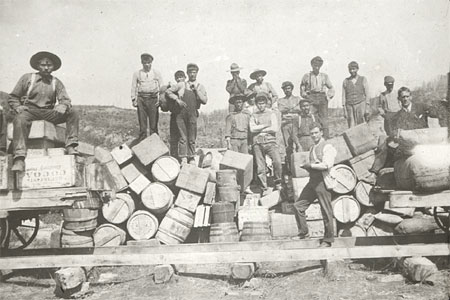 Men and their merchandise at Grand Rapids, Athabasca River in Alberta; A typical scene from the early 20<SUP>th</SUP> century in the provinces of the Canadian West trying to promote the immigration of people from the United States and Britain, © CMC/MCC, S2004-866 LS