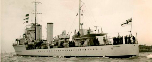 An old photo of a large ship in the water, taken at the Canadian War Museum.