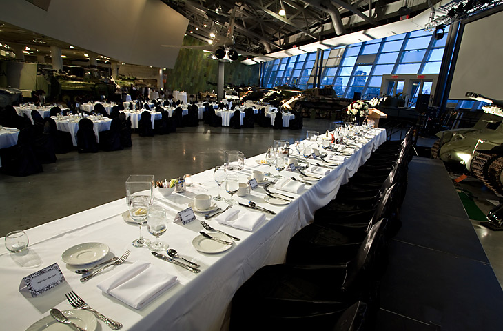 A long table with white linens in Ottawa at the Canadian War Museum.