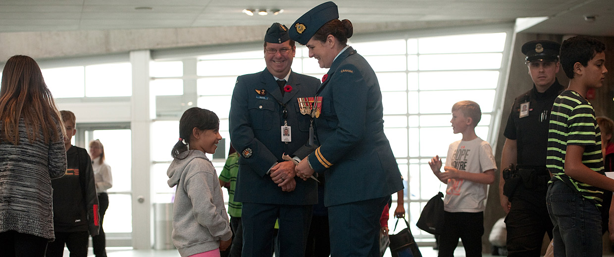 A group of people in uniforms standing in a line at the Canadian War Museum in Ottawa.