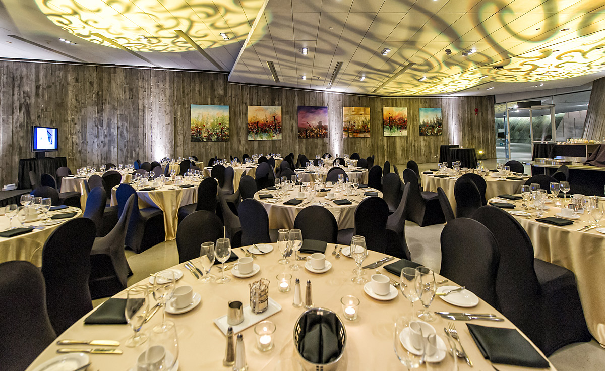 A banquet room set up with tables and chairs inside the Canadian War Museum, in Ottawa.