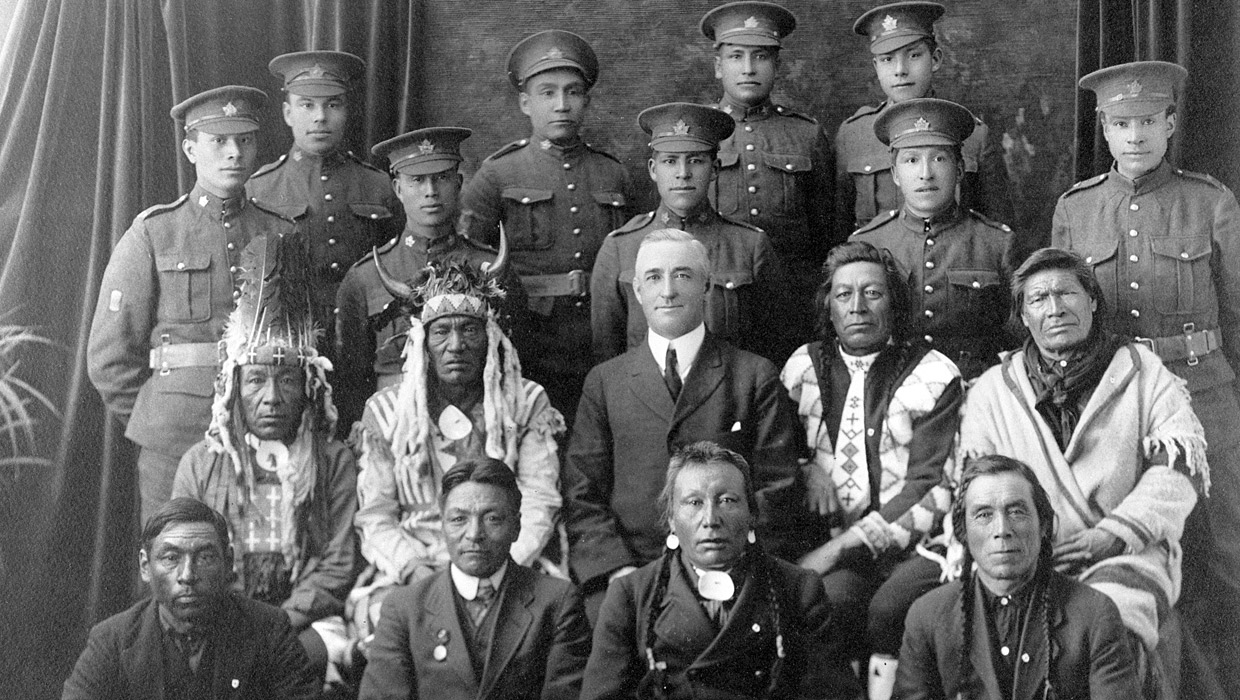 A group of men in uniform posing for a photo at the Canadian War Museum in Ottawa.