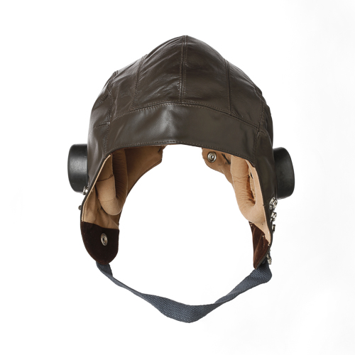 A brown leather helmet on a white background at the Canadian War Museum.