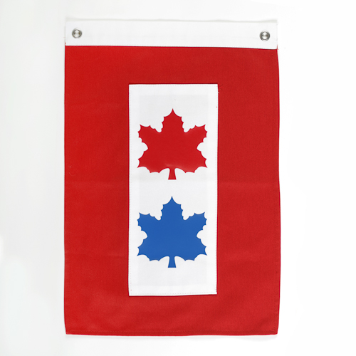 A red and blue flag with two maple leaves on it, proudly flying in Ottawa at the Canadian War Museum.