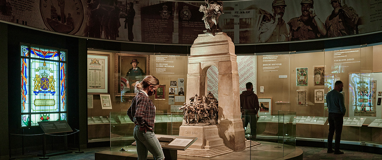 A man is looking at a statue at the Canadian War Museum in Ottawa.