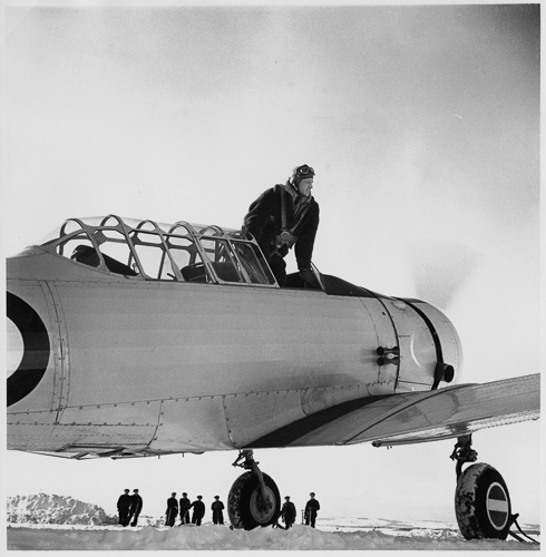 A man standing on the wing of a plane at the Canadian War Museum in Ottawa.