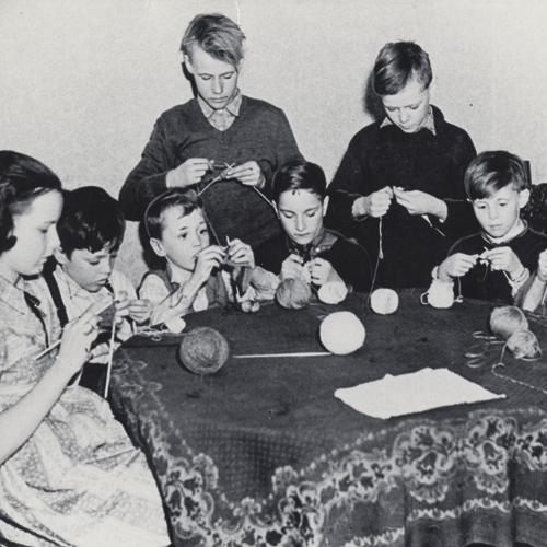 A group of children knitting at the Canadian War Museum in Ottawa.