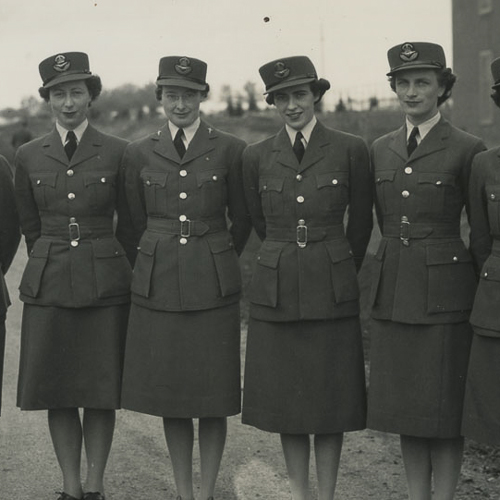 A group of women in uniform standing next to each other at the Canadian War Museum in Ottawa.