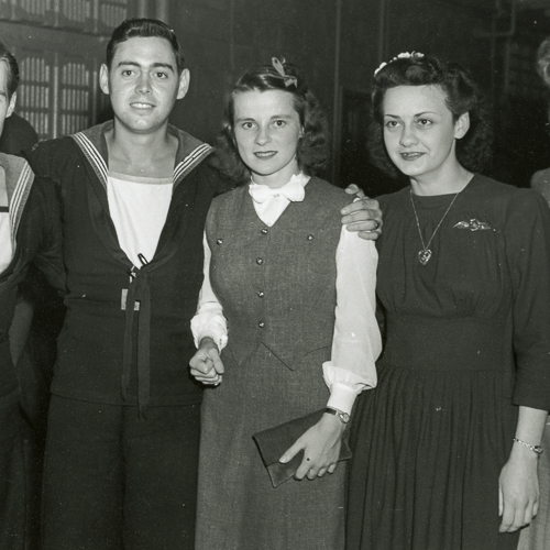 A group of people posing for a picture at the Canadian War Museum in Ottawa.