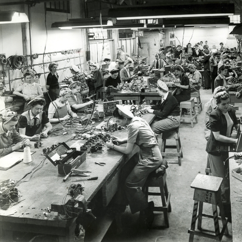 A black and white photo of people working in a factory in Ottawa.