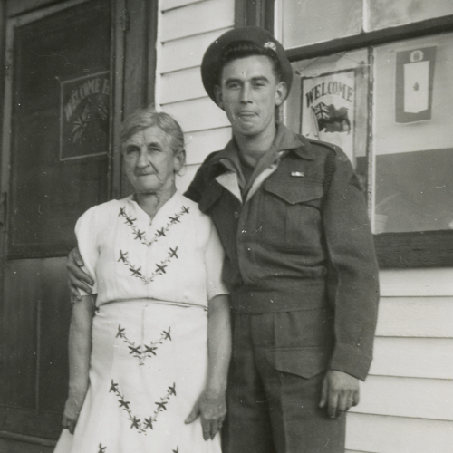 An old black and white photo of a man in uniform and an older woman, taken at the Canadian War Museum in Ottawa.