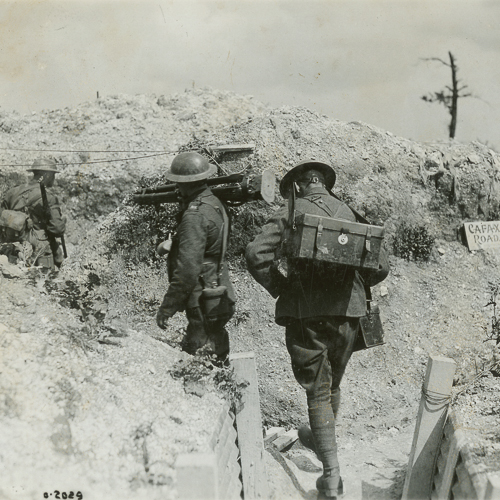 A group of soldiers walking in trenches