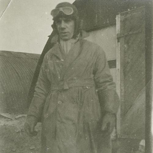 An aviator in a coat and goggles.