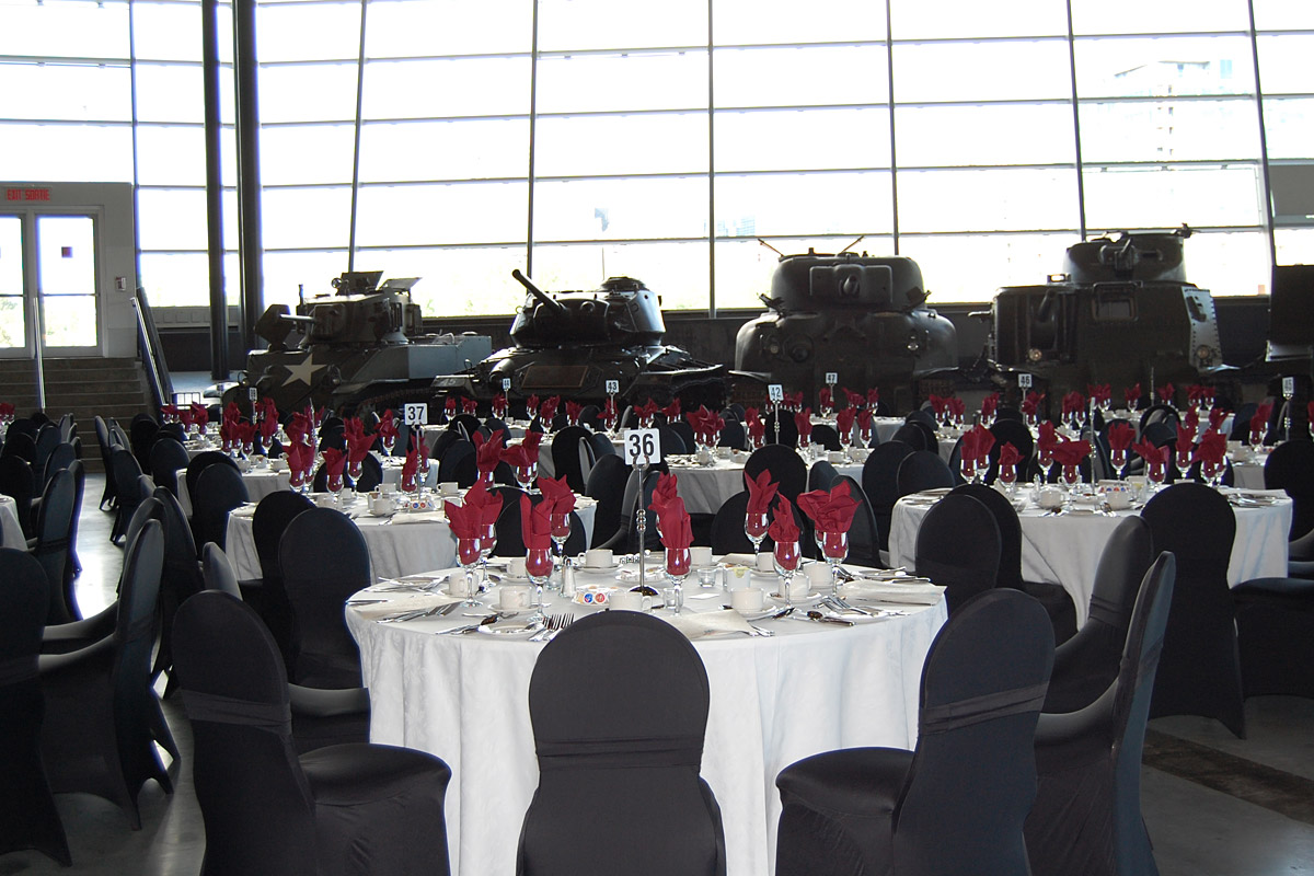 A room filled with tables and chairs in the LeBreton Gallery at the Canadian War Museum.