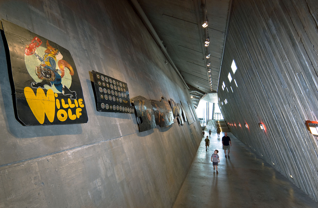 A group of people walking down a hallway in the Canadian War Museum in Ottawa.