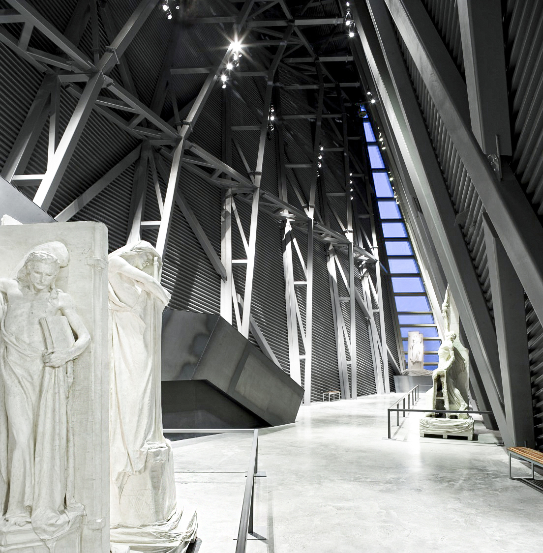 The Canadian War Museum, located in Ottawa, is a large building adorned with statues.