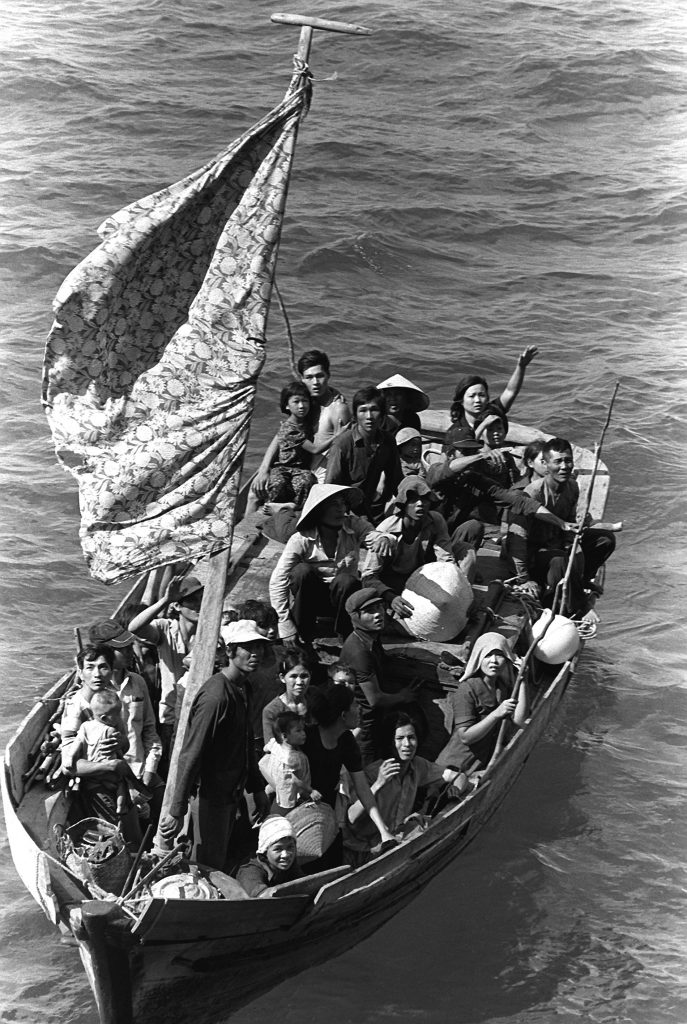 A group of Vietnamese refugees in a boat.