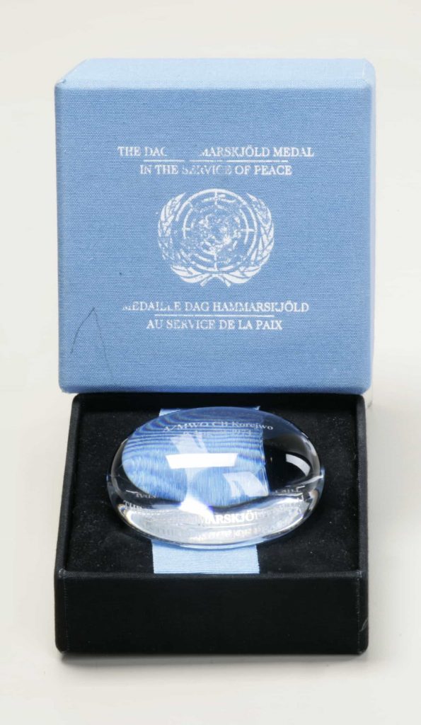 A Dag Hammarskjöld Medal in a blue UN box awarded by the Canadian War Museum in Ottawa.