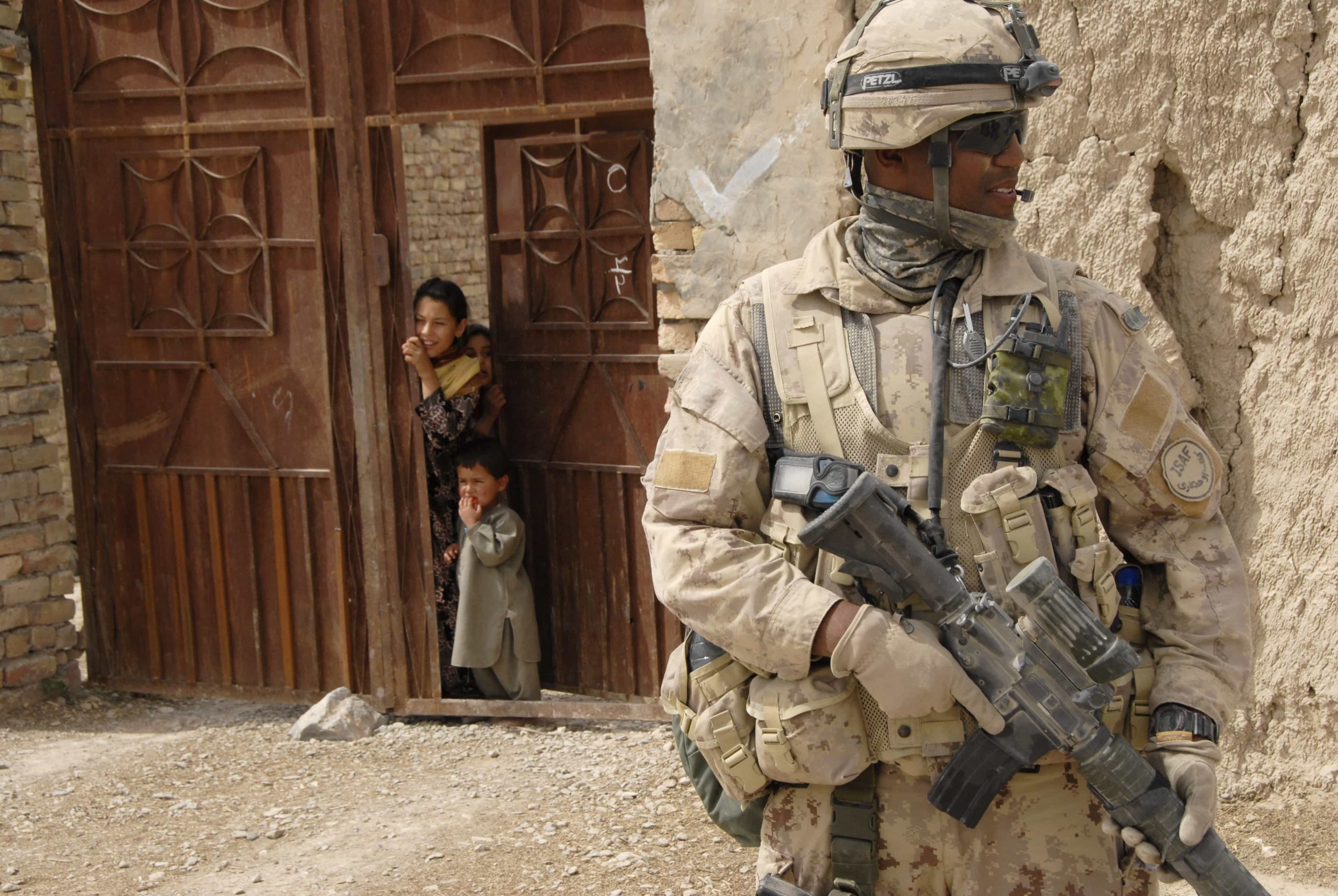 A soldier with a rifle in front of a door at the Canadian War Museum in Ottawa.