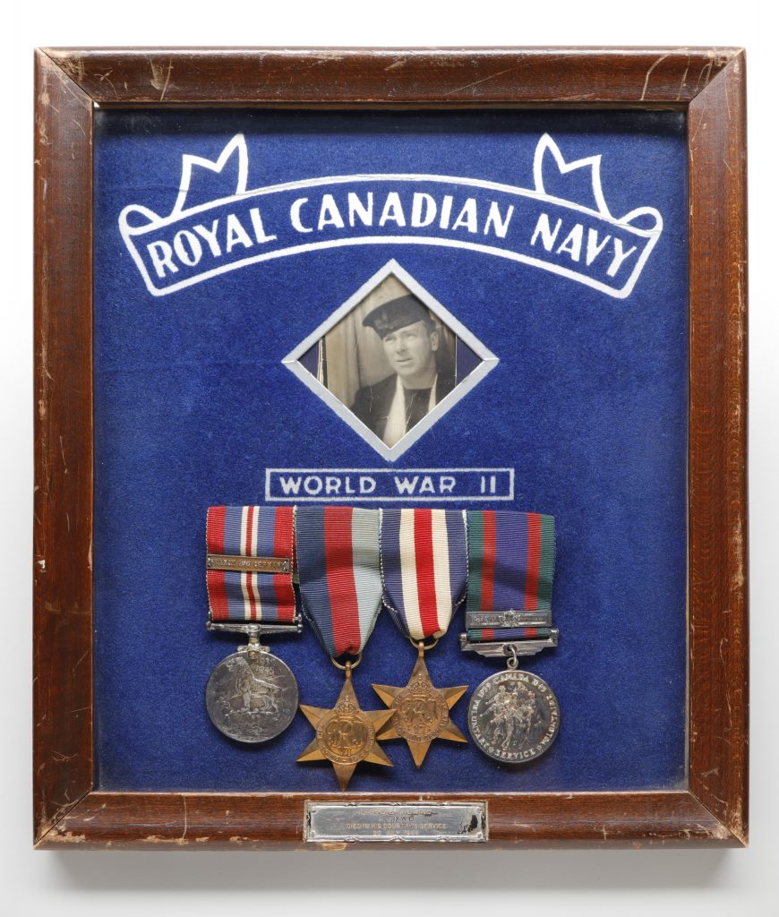 John “Scotty” Laing's Royal Canadian Navy medals are displayed in a wooden frame at the Canadian War Museum in Ottawa.