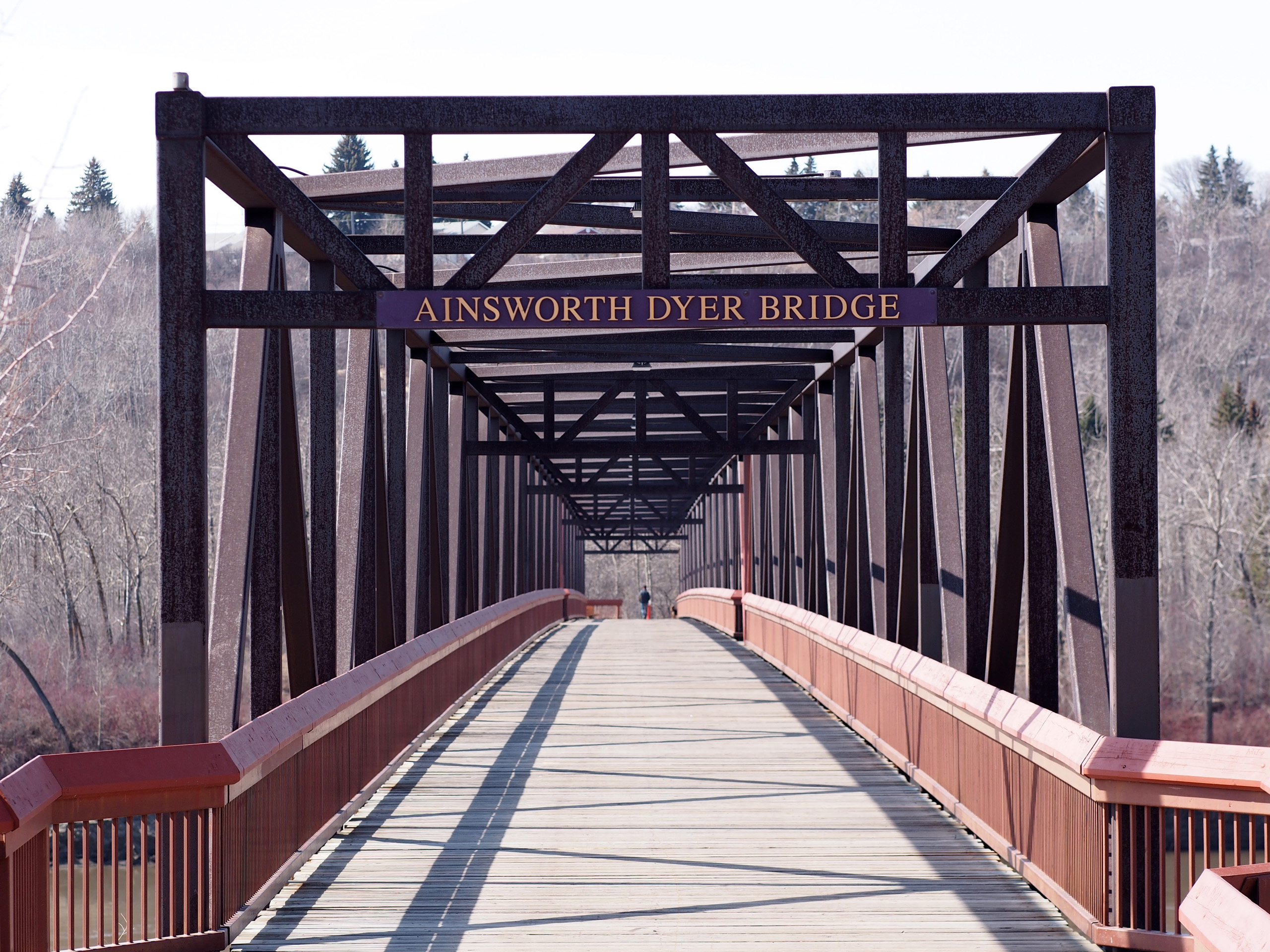 A bridge in Ottawa, near the Canadian War Museum, that spans over a river.