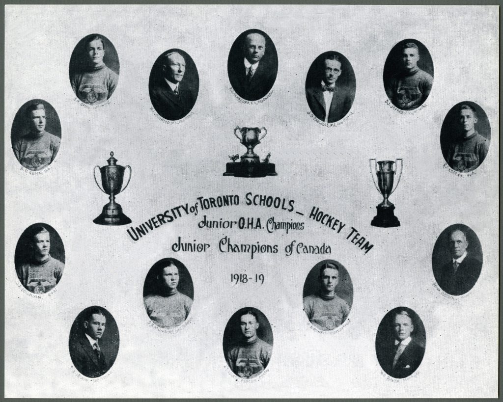 A black and white photo of a group of people with trophies at the Canadian War Museum in Ottawa.