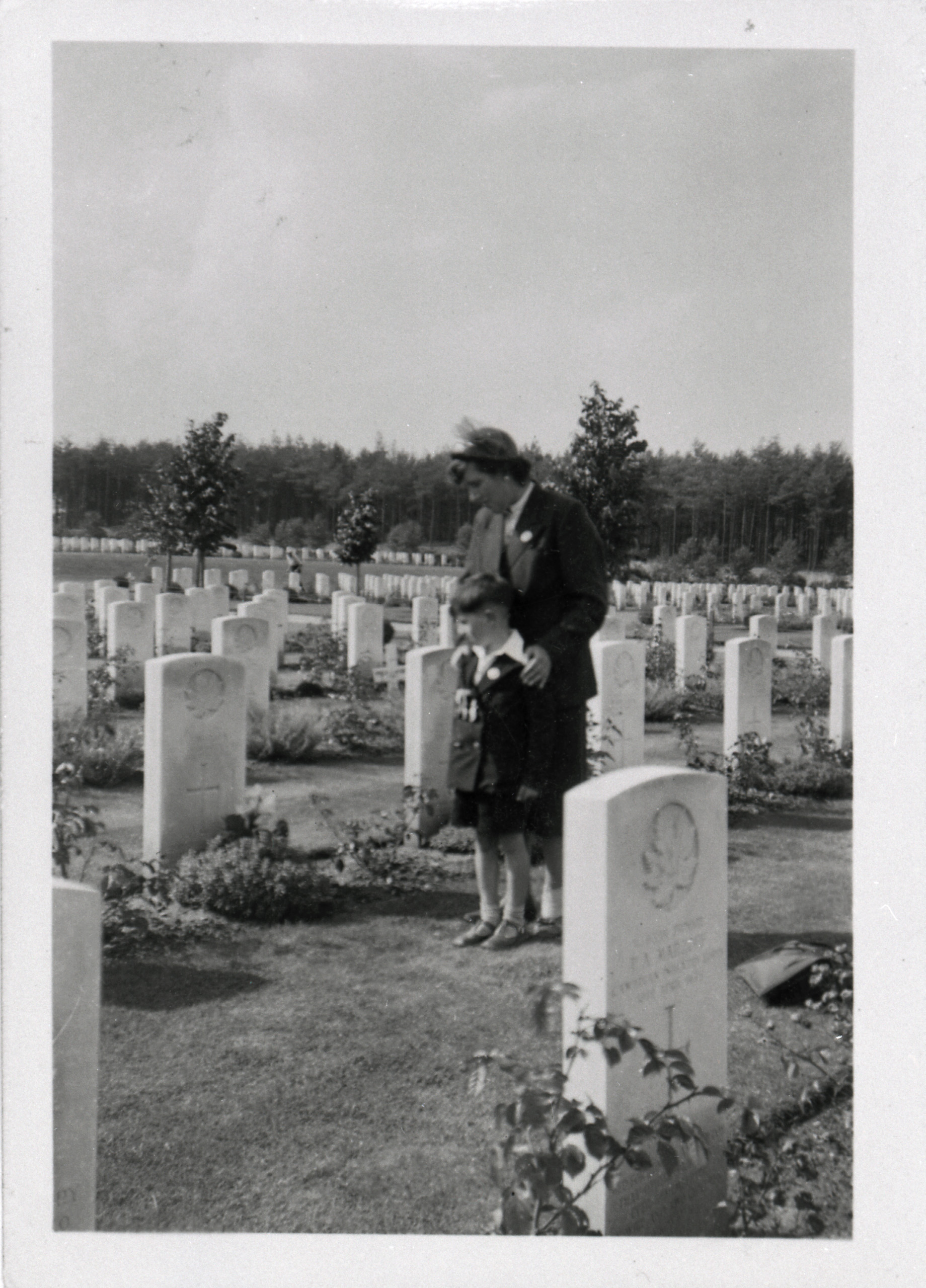 A woman and a man standing in Ottawa cemetery.