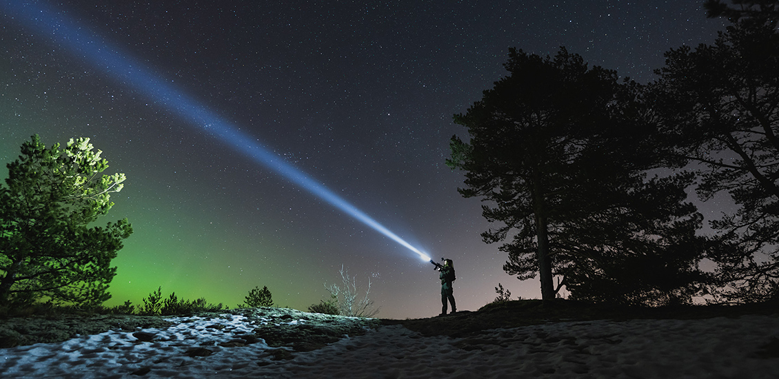 A person looking at the night sky